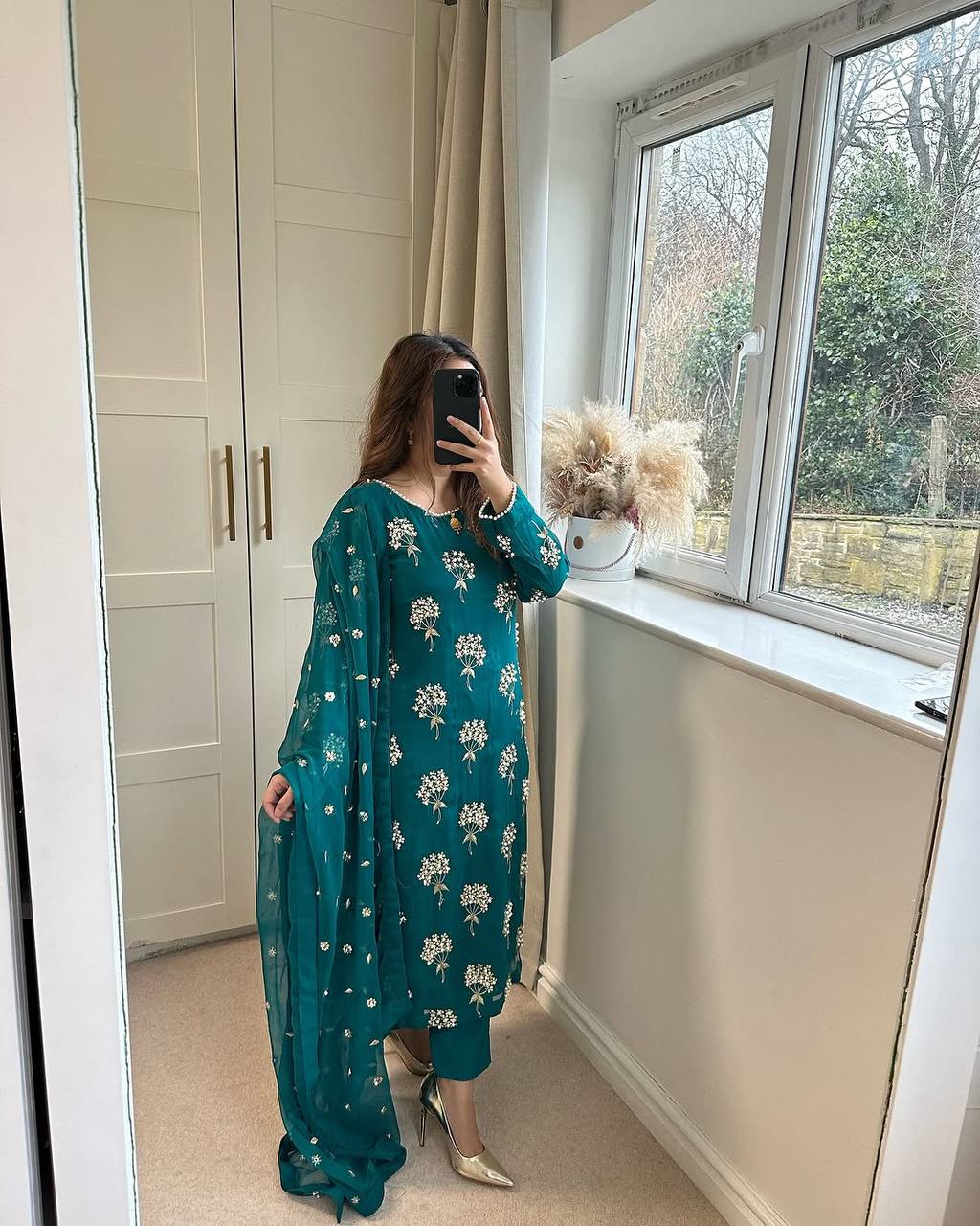 Elegance in Emerald Floral Attire