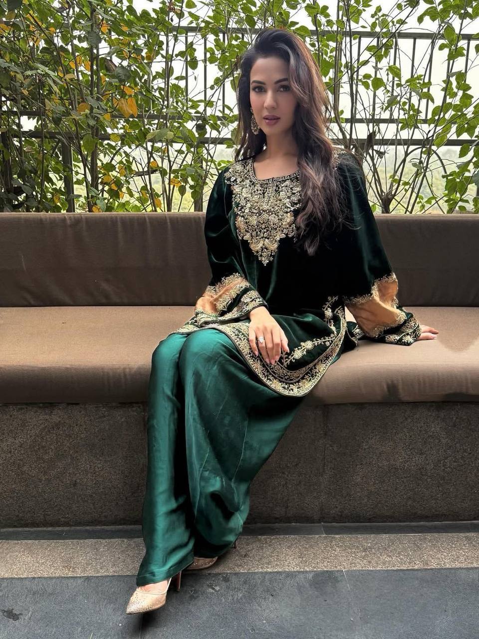 Regal Green Attire with Golden Accents
