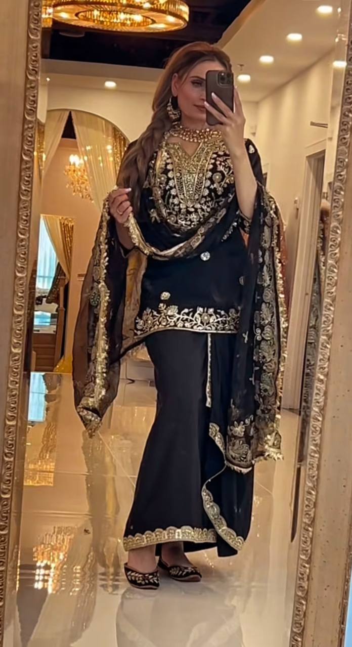 Elegance in Black and Gold Attire