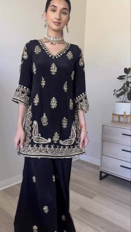 Regal Attire: Black and Gold Splendor